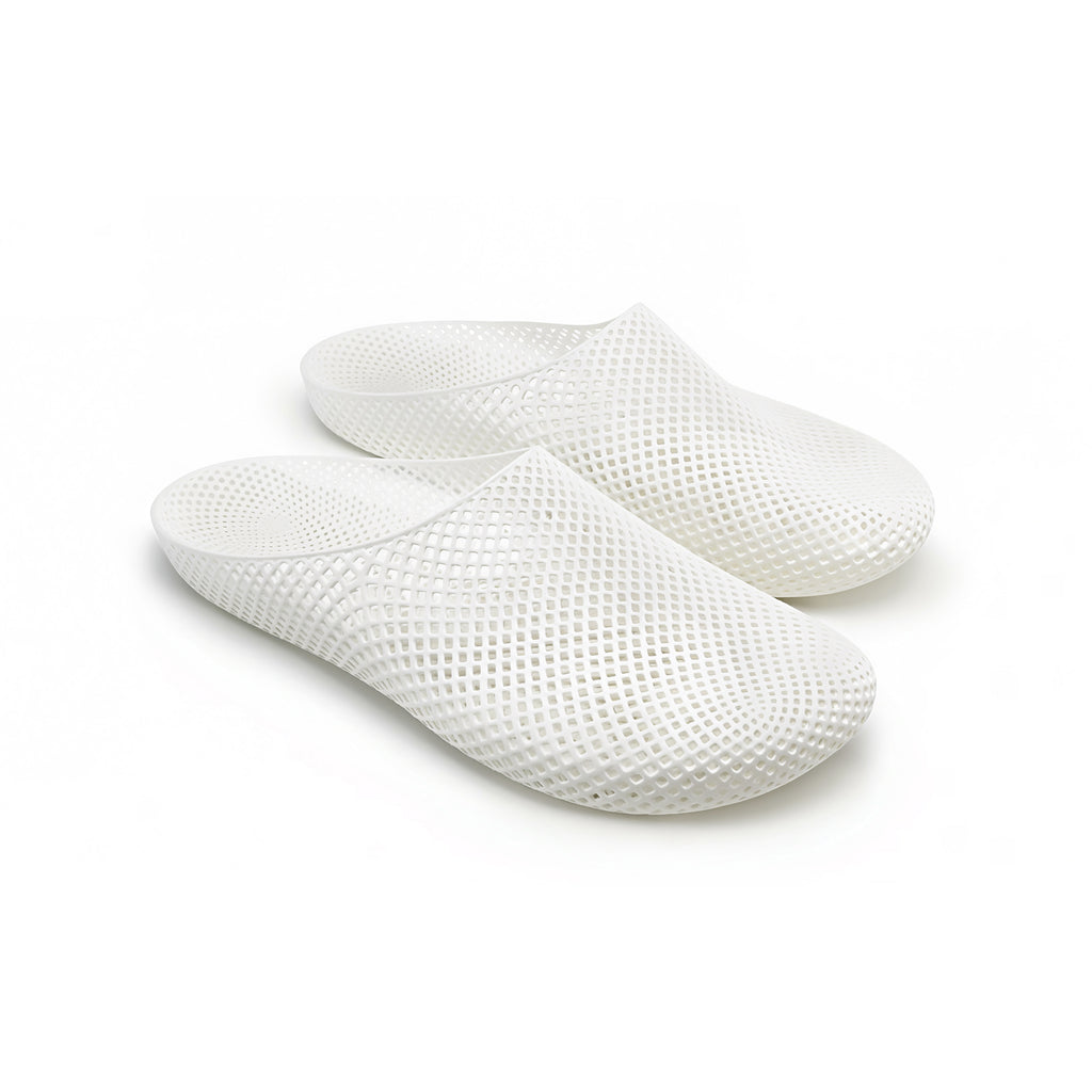 ARKKY CozLite 101 3D printed slippers in a minimalist travel setting